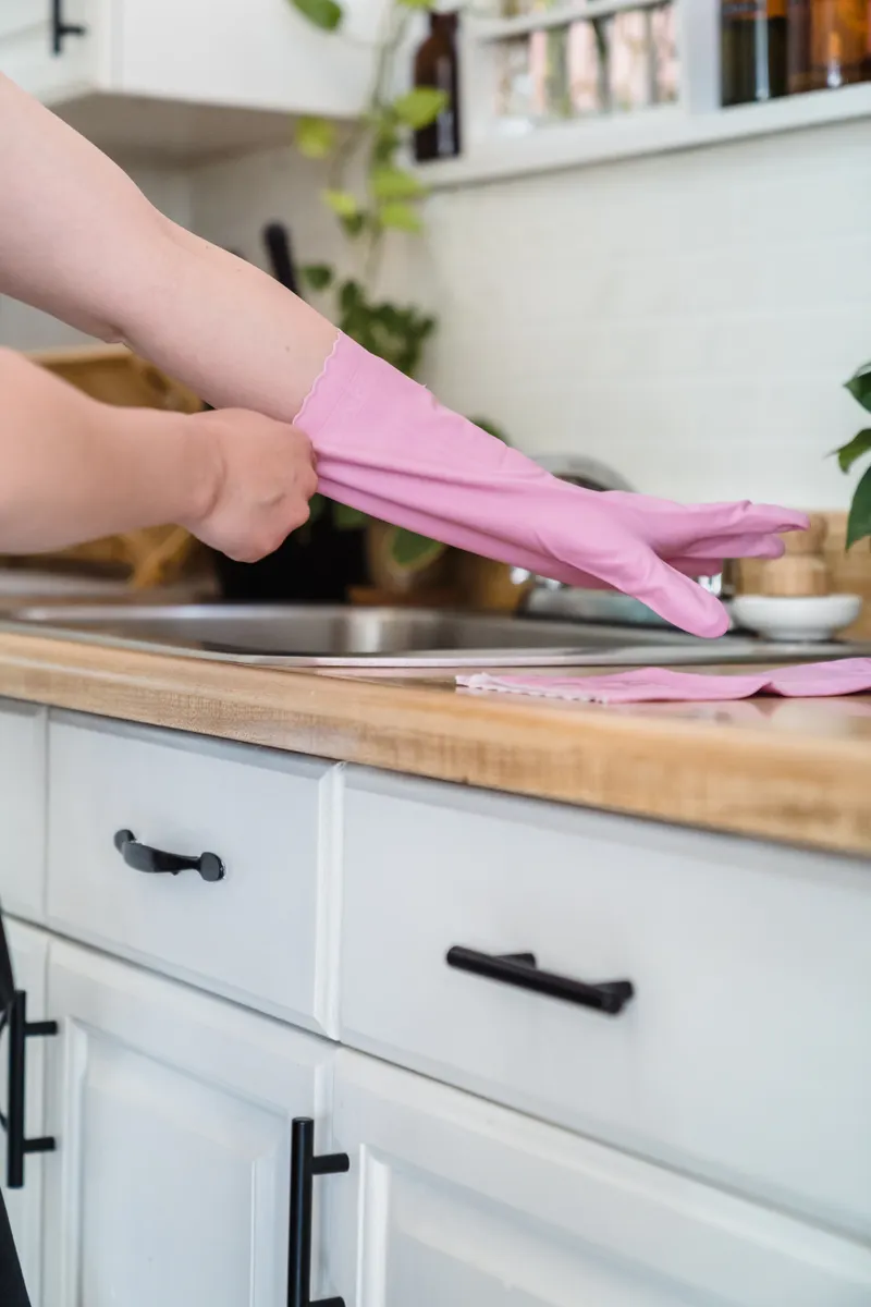 Using gentle cleaning tools to avoid scratching delicate kitchen countertops and finishes.