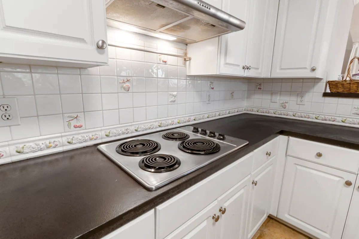 Concrete countertop sections alongside tile requiring specific cleaning and sealing care.
