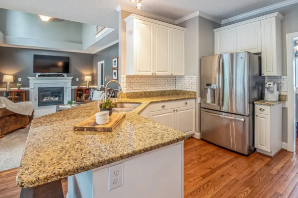 A clean polished granite countertop with a soft microfiber cloth and mild soap setup for daily care.