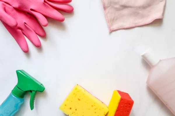 Assorted kitchen cleaning cloths and sponges neatly arranged on a countertop for daily cleanup.