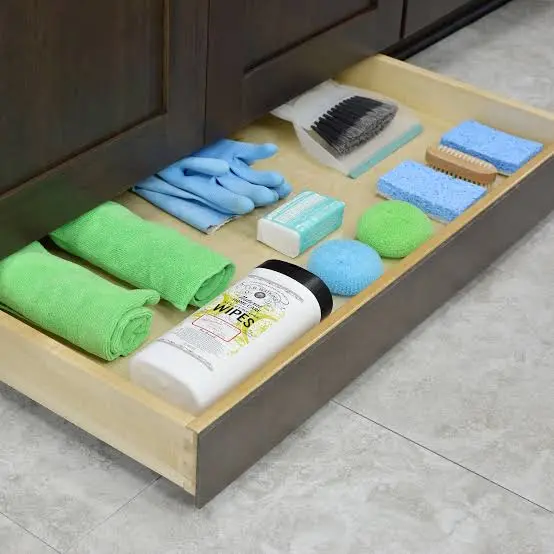 Cleaning supplies arranged for a safe kitchen countertop routine.