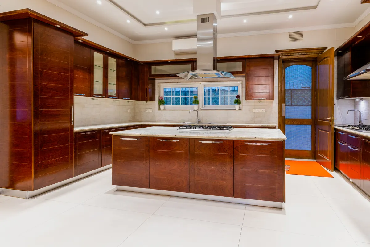 Different kitchen countertop materials including marble and wood sections side by side.