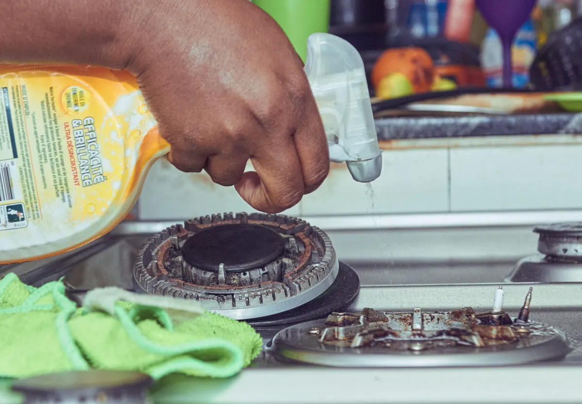 An oven interior and appliances representing monthly kitchen deep cleaning tasks.