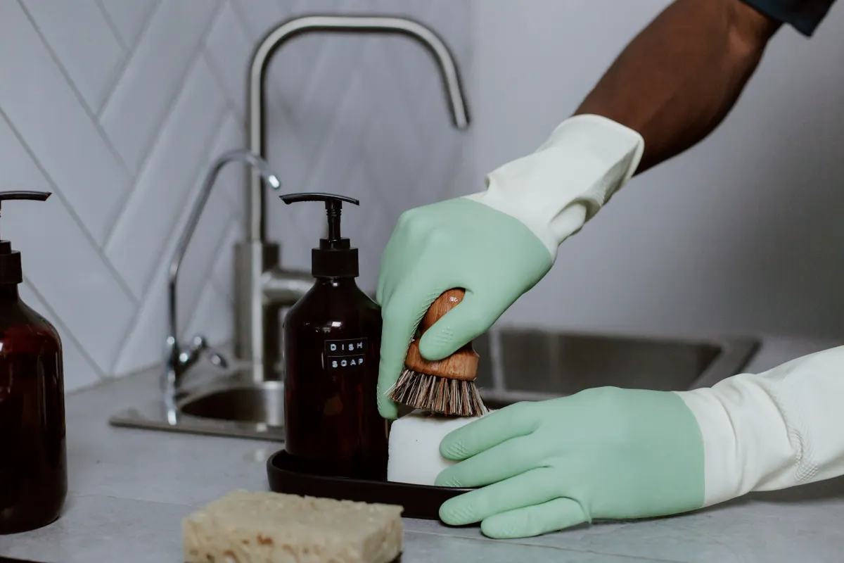 Dish soap and baking soda paste used for natural kitchen grease removal.