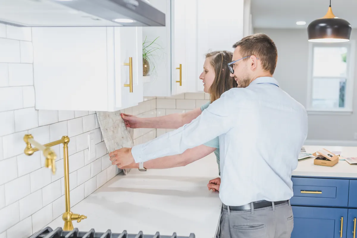 Checking countertop surface materials carefully before selecting safe cleaning products.