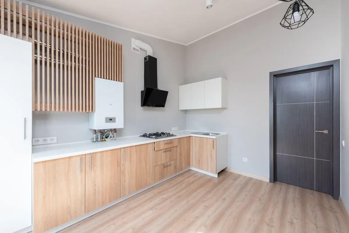 A well-ventilated kitchen space after a recent renovation with good airflow.