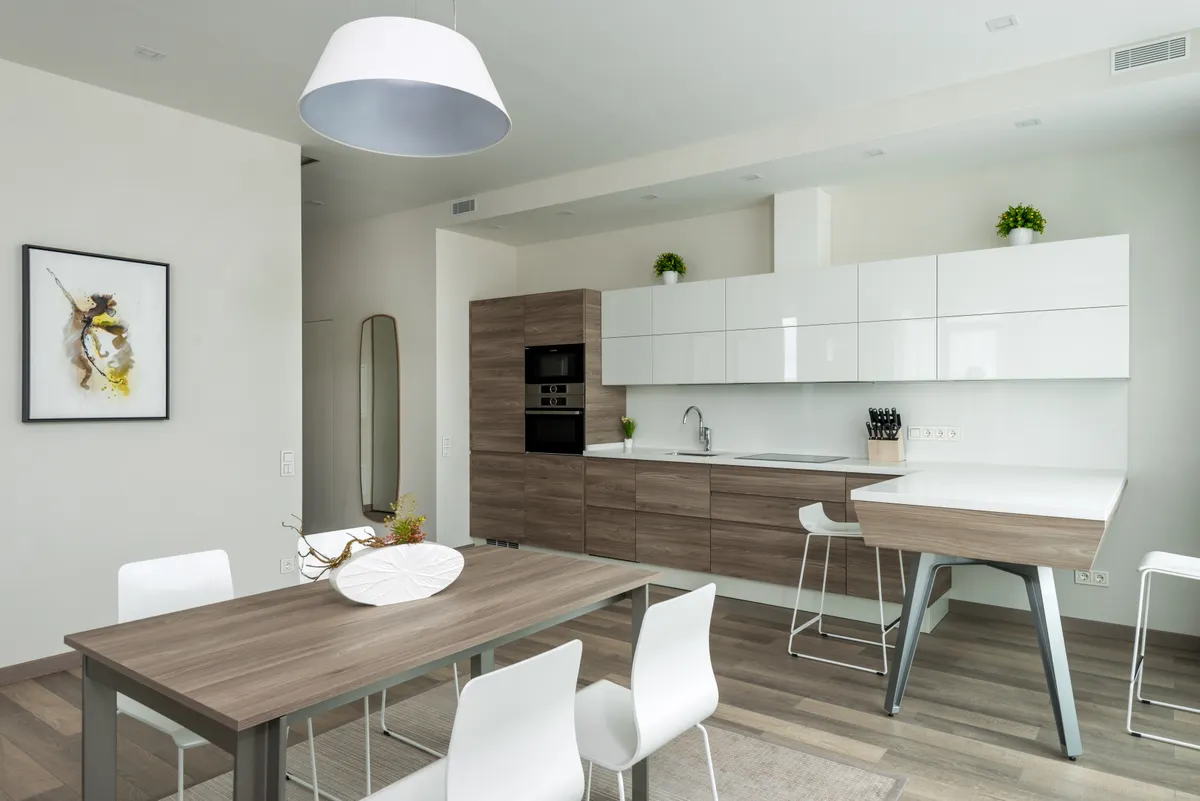 Wiping down smooth laminate and thermofoil kitchen cabinets carefully to protect the finish.