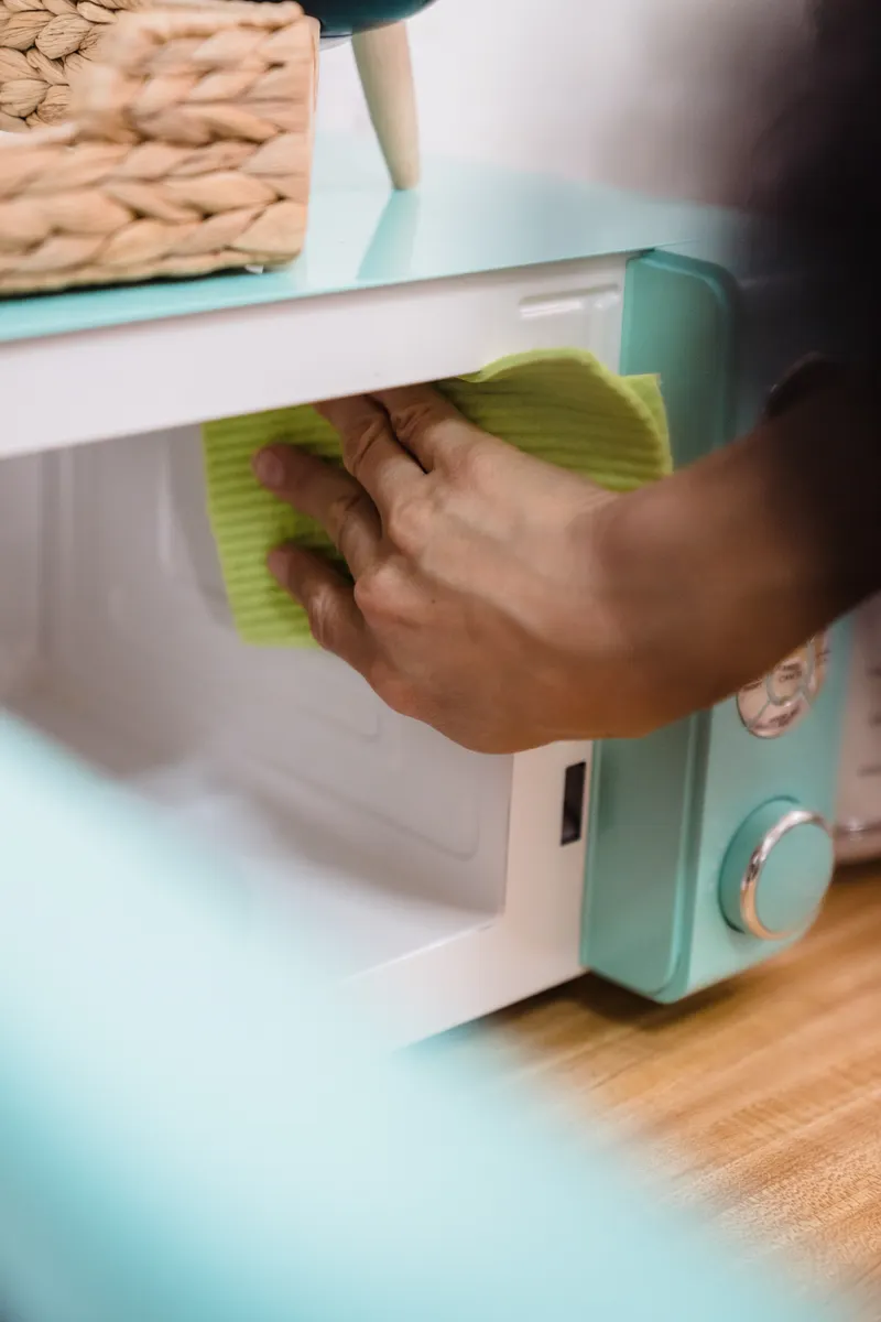 A regularly used microwave interior showing how routine cleaning prevents grease buildup.