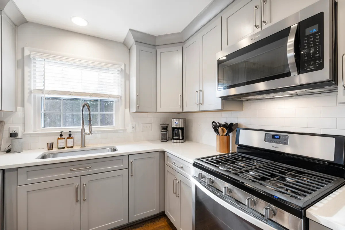 Over the range microwave appliance installed above the stove with built in vent system.