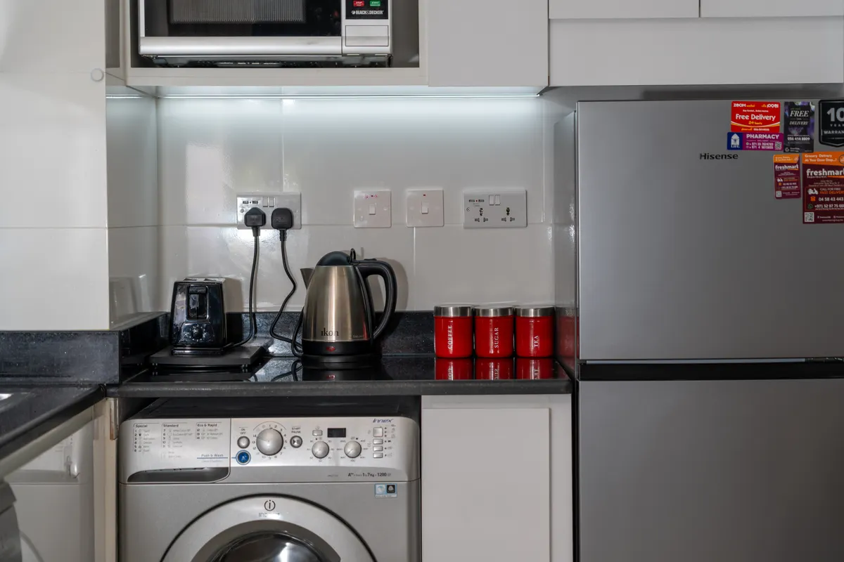 Small kitchen appliances pulled away from the wall to check behind and underneath them.