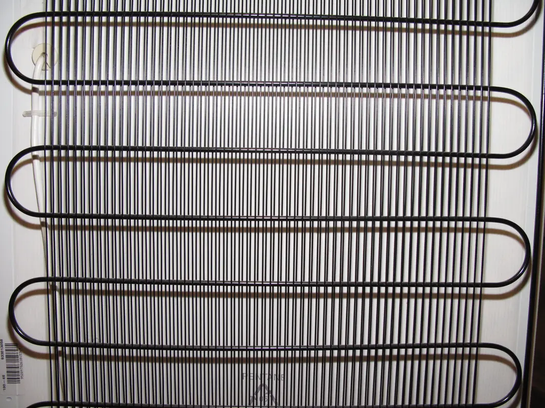 Diagram showing common refrigerator coil locations, front grille or back.