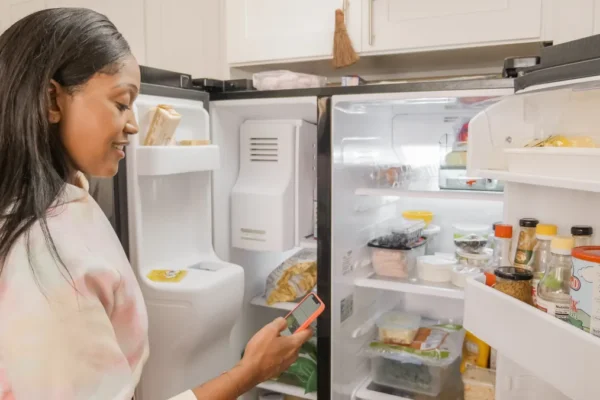 A clean refrigerator interior with organized shelves and spotless compartments ready for fresh groceries.