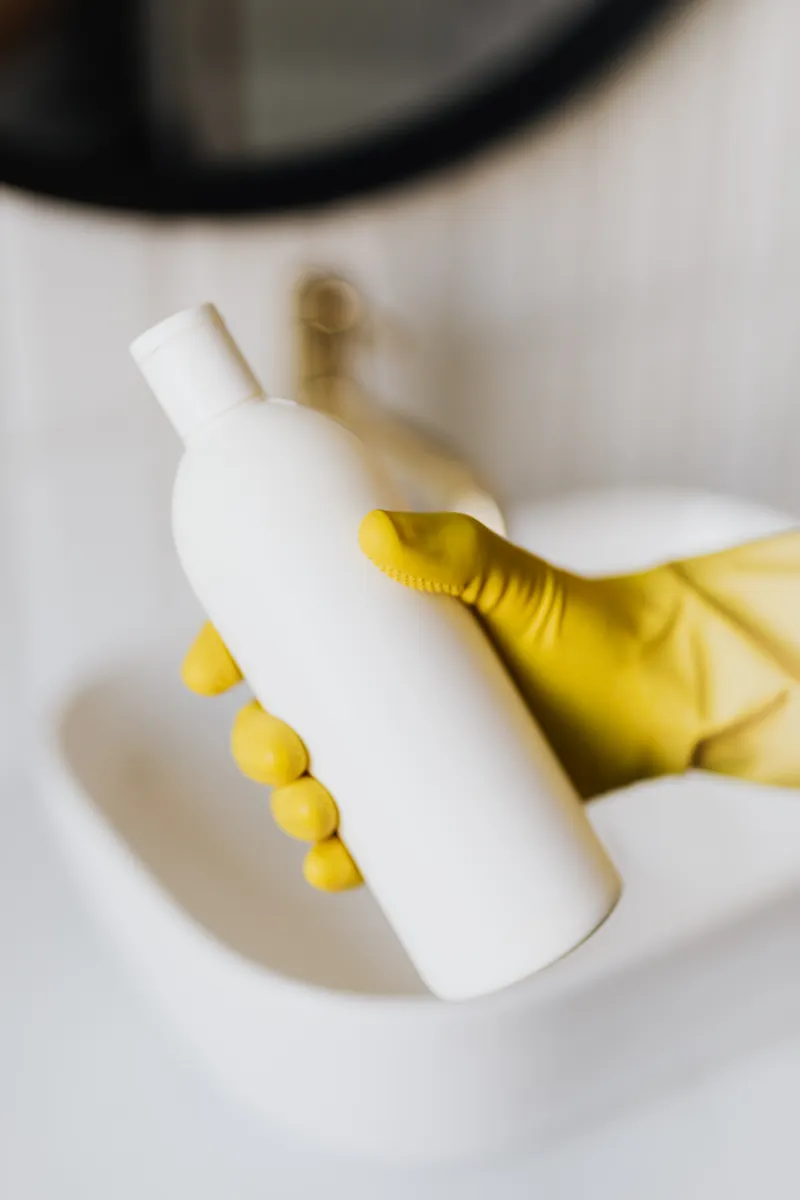 Using safe, material-appropriate cleaning solutions on kitchen countertops.