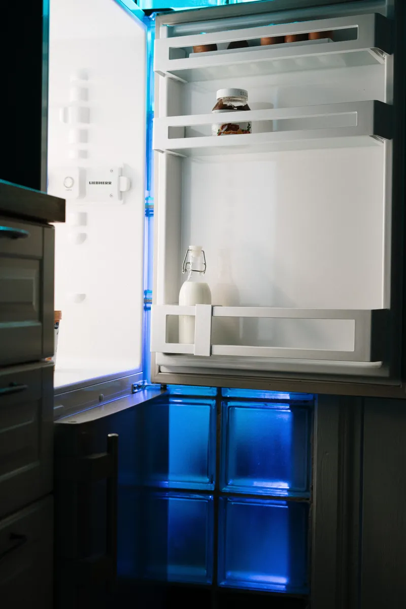 Using safe cleaning products like baking soda solution on refrigerator interior surfaces.