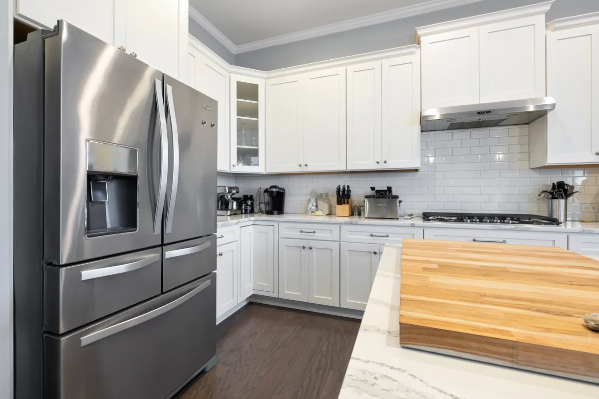 Stainless steel refrigerator exterior showing brushed grain direction and smudge prone metal surfaces.