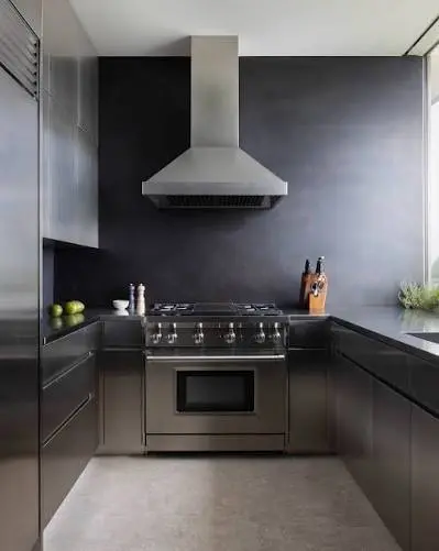 Buffing a stainless steel countertop for a high gloss, showroom-quality shine.