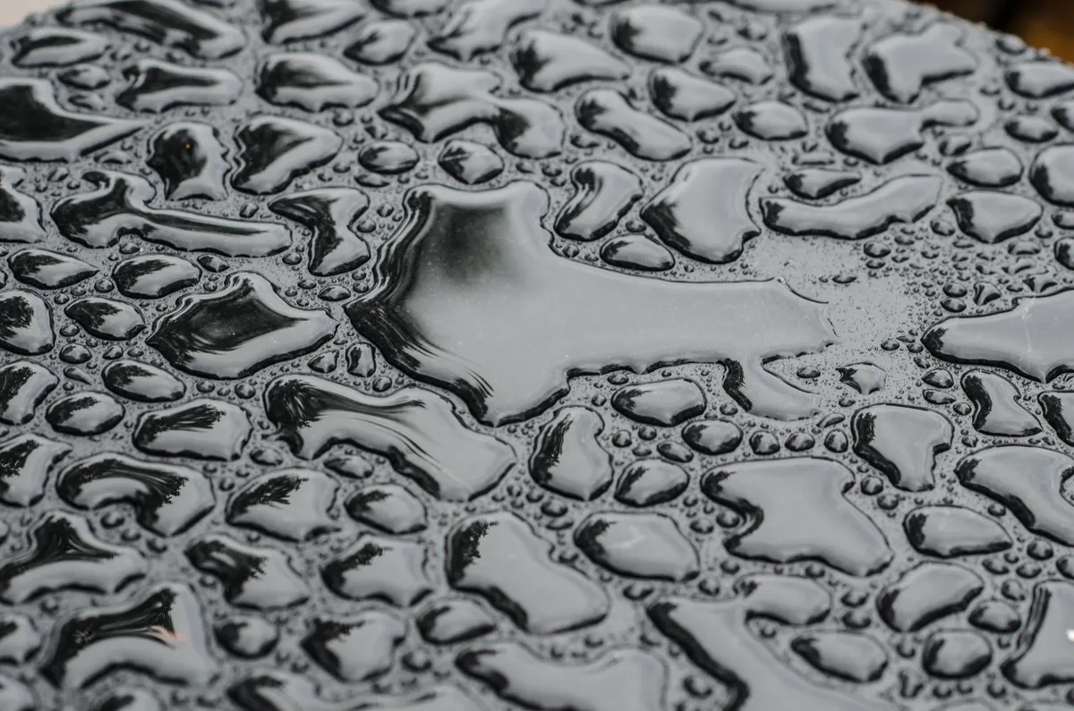 Illustration showing damaging effects of water on unfinished wood countertops.